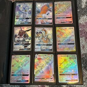 79 holographic Pokémon cards in binder